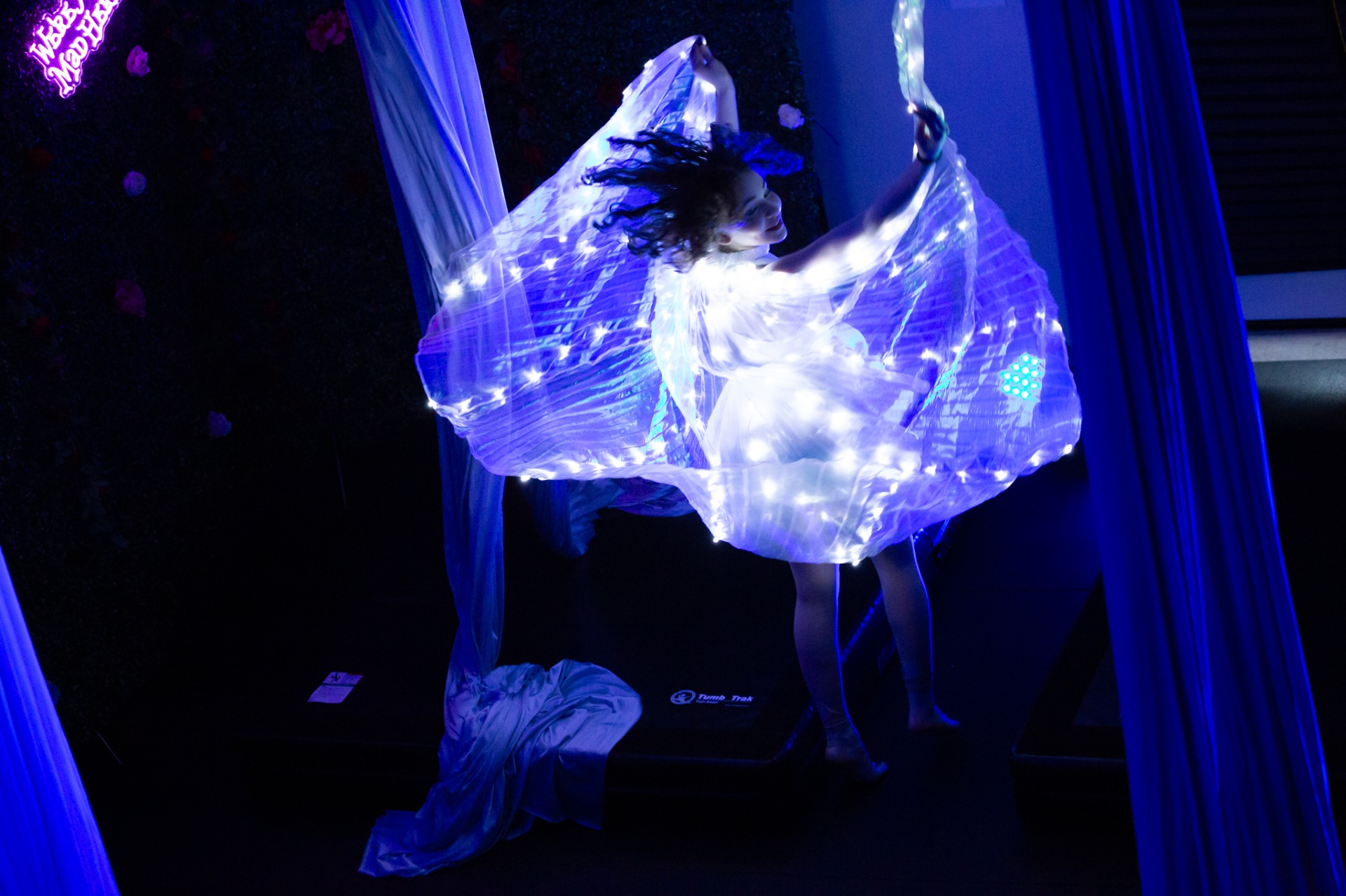 Glowing aerial silk performance